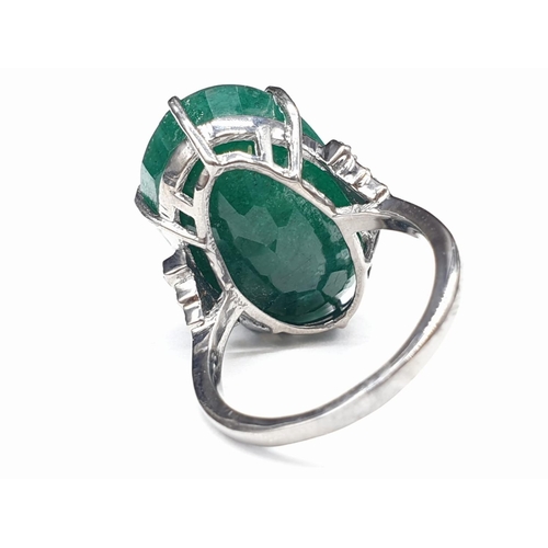 289 - 22 Ct Emerald set within a 925 silver ring, with 0.20 Cts Rose cut diamonds, WEIGHT 7.5g and size M