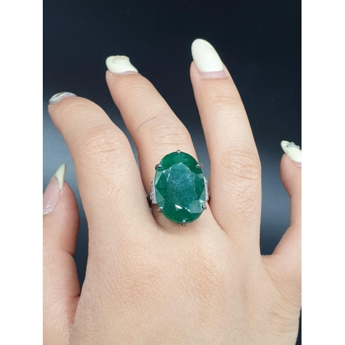 289 - 22 Ct Emerald set within a 925 silver ring, with 0.20 Cts Rose cut diamonds, WEIGHT 7.5g and size M