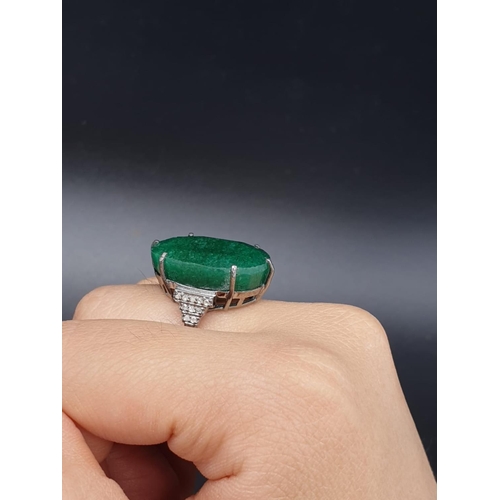 289 - 22 Ct Emerald set within a 925 silver ring, with 0.20 Cts Rose cut diamonds, WEIGHT 7.5g and size M