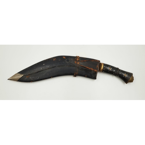 297 - A vintage kukri knife with gilded lions head, on handle and decorative engraving on blade. Comes wit... 