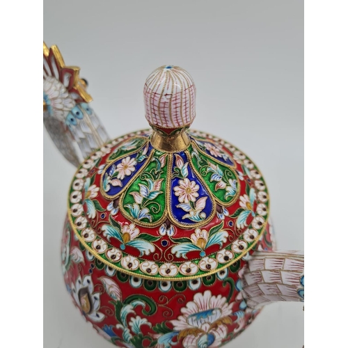 13 - An Antique Russian Silver and Enamel Sugar Bowl. Gilded and enamelled silver in the shape of two bir... 