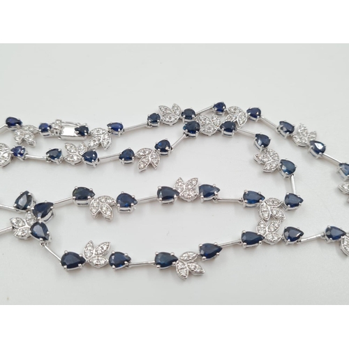 14 - An 18ct White Gold Sapphire and Diamond Necklace with Matching Earrings. Diamond weight 2.67 carats ... 