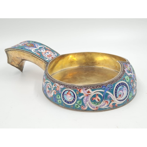 24 - An Antique Russian Silver Gilt and Enamel Kovsh. Enamelled with floral garlands against cream and gr... 