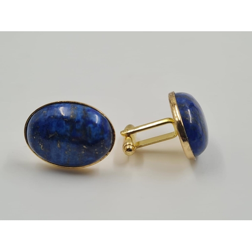 450 - A Set of Lapis Lazuli Cufflinks. Large stones on a gilded metal base. 2.5cm. Comes with box.