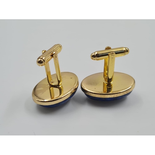 450 - A Set of Lapis Lazuli Cufflinks. Large stones on a gilded metal base. 2.5cm. Comes with box.