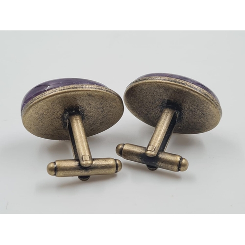 465 - A Pair of Large Amethyst Cufflinks. Bronze Backs. 
Stones 2.5cm in length.