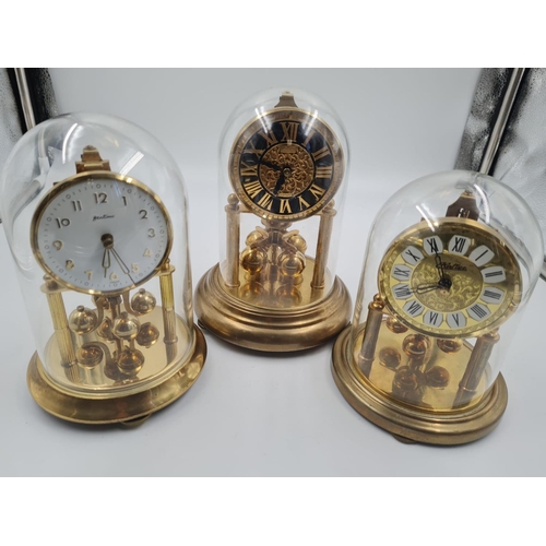 471 - A Trio of Glass-Domed Eight-Day Clocks. 20cm