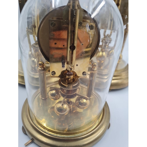 471 - A Trio of Glass-Domed Eight-Day Clocks. 20cm