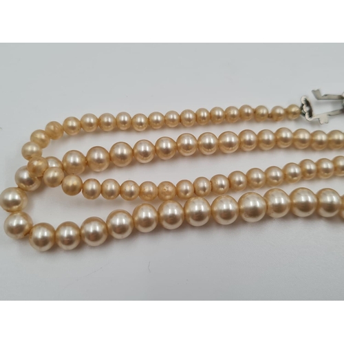 479 - A Vintage Set of Simulated Pearls. Made by the Delta Company. Original Box. 72cm.