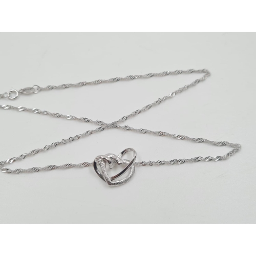 486 - A Beautiful Silver Necklace with intertwined heart pendant. 40cm. As new, in box. 2.76g