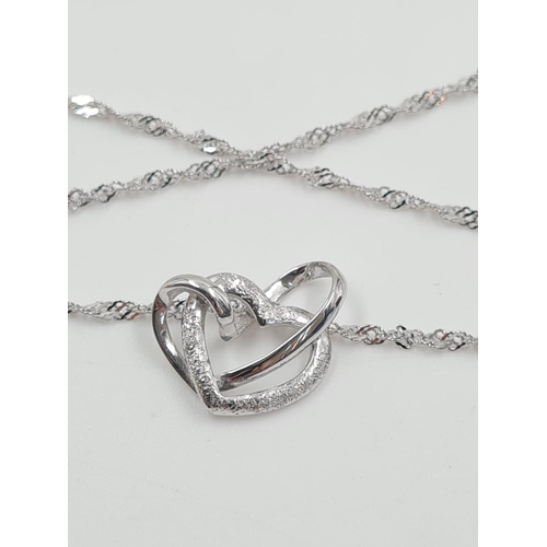 486 - A Beautiful Silver Necklace with intertwined heart pendant. 40cm. As new, in box. 2.76g