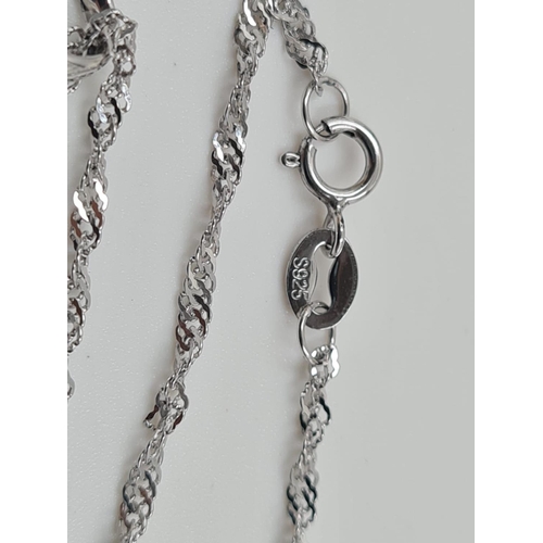 486 - A Beautiful Silver Necklace with intertwined heart pendant. 40cm. As new, in box. 2.76g