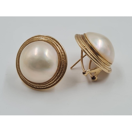 694 - A Pair of 14ct Gold and Pearl Earrings. Circular design. 2cm diameter. 9.3g total weight.