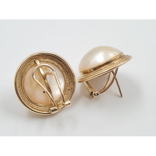 694 - A Pair of 14ct Gold and Pearl Earrings. Circular design. 2cm diameter. 9.3g total weight.