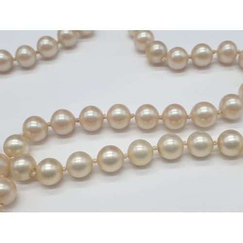 162 - A Belle Epoque Majorca pearl necklace with a 14 carat clasp, on multi silk string with individually ... 