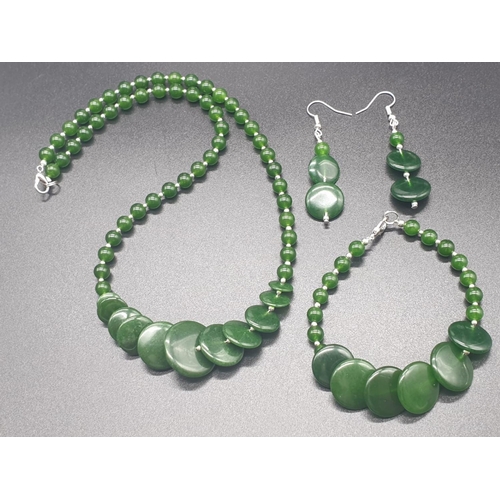 170 - A modern spinach green jade necklace, bracelet and earrings set in a presentation box. Necklace leng... 