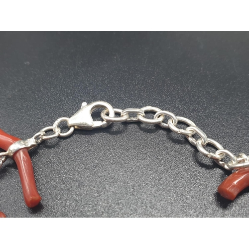 190 - A very elegant, sterling silver (stamped 925) and Mediterranean red coral bracelet and earrings set ... 