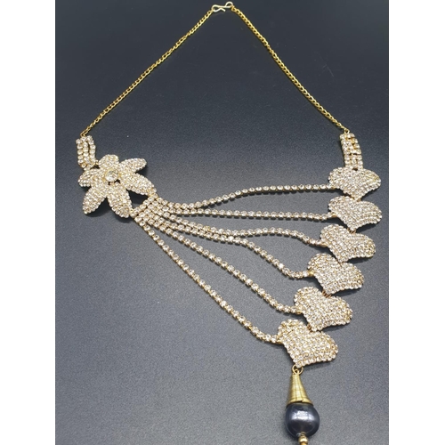 391 - Get ready for the summer ball! A beautiful yellow metal and Swarovski crystals asymmetric necklace a... 