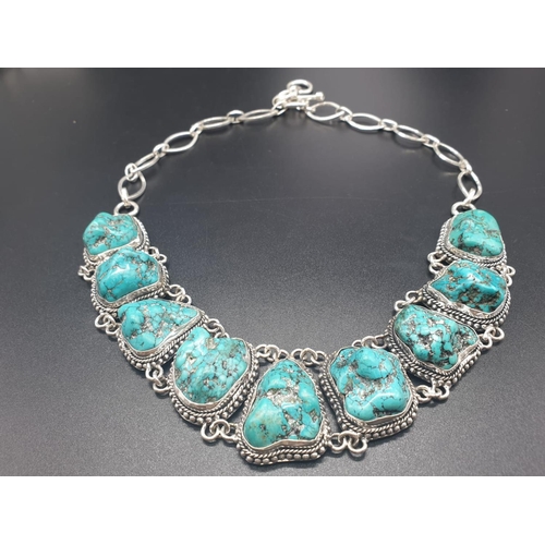 392 - A necklace and bracelet set with naturalistic large turquoise cabochons. In a presentation box. Neck... 