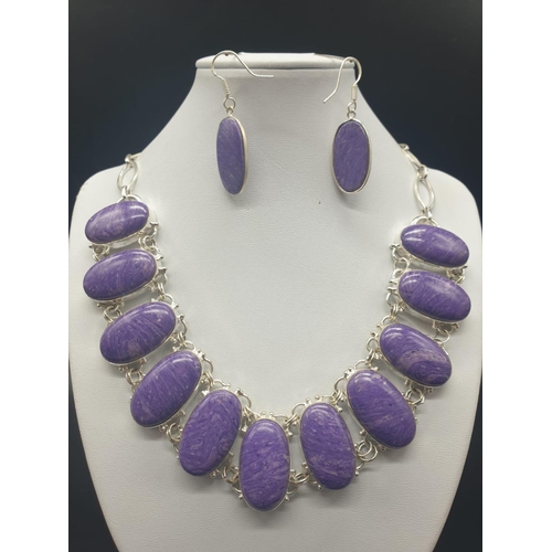 52 - A rare and beautiful white metal (untested) Russian charoite necklace and earrings set in a presenta... 