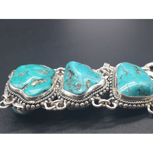 392 - A necklace and bracelet set with naturalistic large turquoise cabochons. In a presentation box. Neck... 