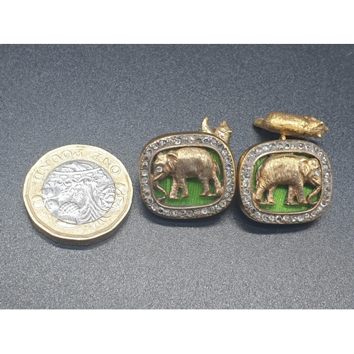 107 - A PAIR OF SILVER WITH ENAMEL AND DIAMOND RUSSIAN CUFFLINKS DEPICTING AN ELEPHANT AND BEAR