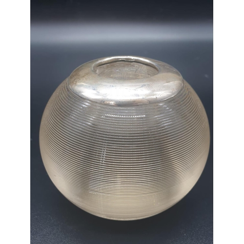 114 - AN ART DECO ASHTRAY/CANDLE HOLDER MADE IN HEAVY GLASS BALL SHAPE WITH A SILVER COLLAR HALLMARKED CHE... 