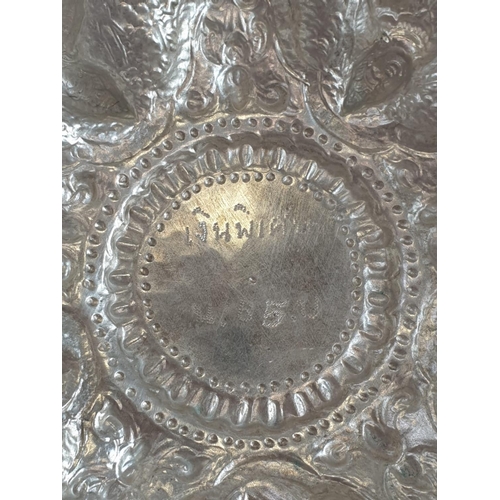 117 - AN 11 PIECE ANTIQUE BURMESE SILVER PUNCH BOWL BEAUTIFULLY ENGRAVED WITH ORIENTAL GODS AND TOPPED WIT... 