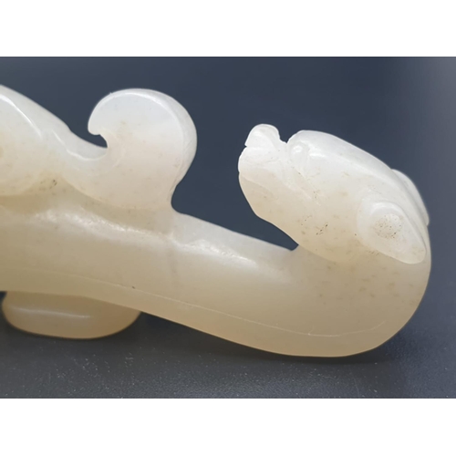 199 - CHINESE JADE FIGURINE OF A DRAGON . 44.1 gms and 8 cms IN LENGTH