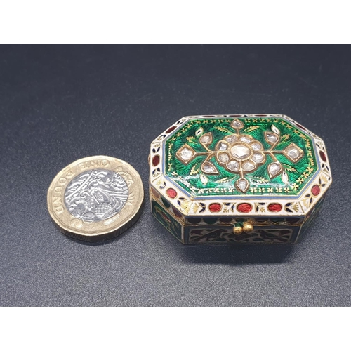 63 - An exquisitely decorated 22ct gold and enamel pill box adorned with diamonds, 4 x 2.8cms and weighin... 