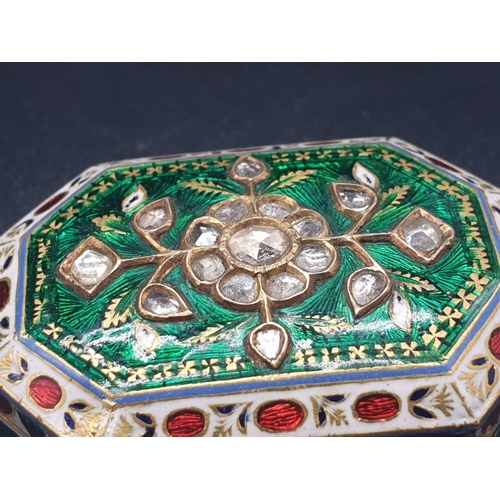 63 - An exquisitely decorated 22ct gold and enamel pill box adorned with diamonds, 4 x 2.8cms and weighin... 
