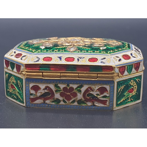 63 - An exquisitely decorated 22ct gold and enamel pill box adorned with diamonds, 4 x 2.8cms and weighin... 