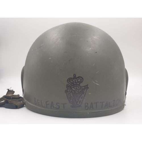 245 - A British Army Ulster Defence Regiment Helmet from the 1970s. The Private is named on the helmet wit... 