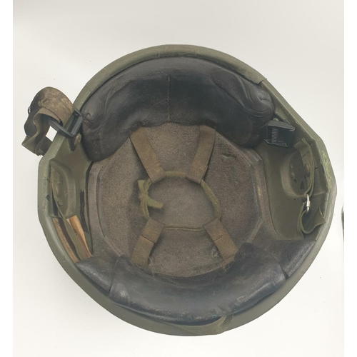 245 - A British Army Ulster Defence Regiment Helmet from the 1970s. The Private is named on the helmet wit... 