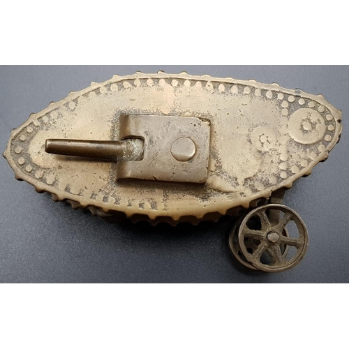 876 - WW1 Trench-Art Brass Tank. Duel Movable Guns. Wheels on rear, 13 x 3cm.