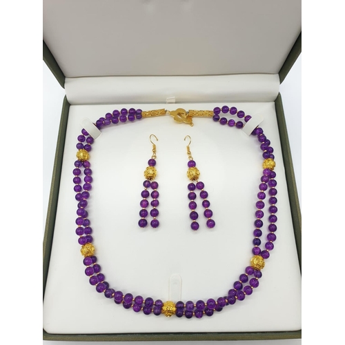 602 - A Mary Quant style necklace and earrings set with synthetic amethyst, following the philosophy of th... 