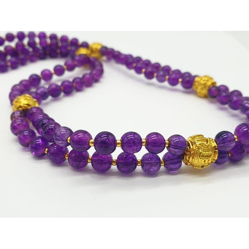 602 - A Mary Quant style necklace and earrings set with synthetic amethyst, following the philosophy of th... 