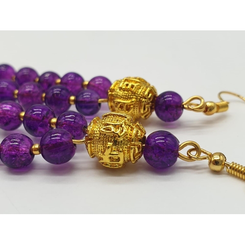 602 - A Mary Quant style necklace and earrings set with synthetic amethyst, following the philosophy of th... 