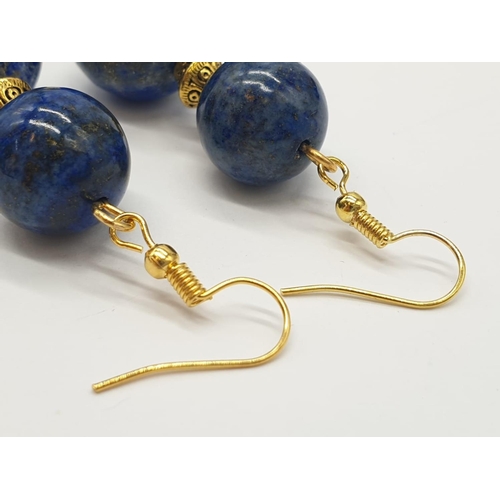 648 - A quality lapis lazuli necklace and earrings set in a presentation box. Necklace length: 49-53cm, ea... 