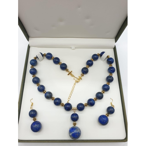 648 - A quality lapis lazuli necklace and earrings set in a presentation box. Necklace length: 49-53cm, ea... 