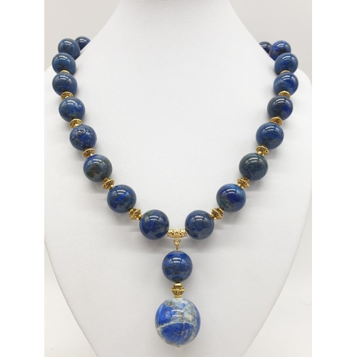 648 - A quality lapis lazuli necklace and earrings set in a presentation box. Necklace length: 49-53cm, ea... 