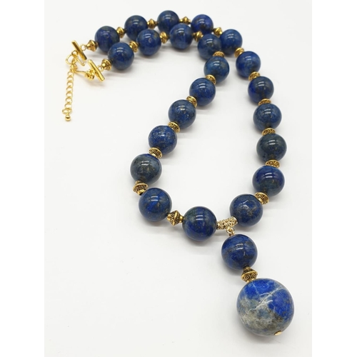 648 - A quality lapis lazuli necklace and earrings set in a presentation box. Necklace length: 49-53cm, ea... 