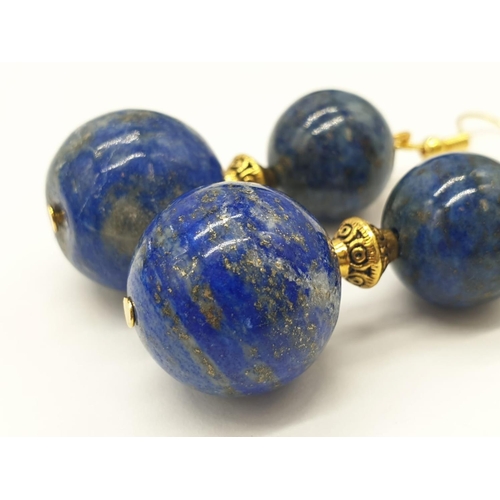 648 - A quality lapis lazuli necklace and earrings set in a presentation box. Necklace length: 49-53cm, ea... 