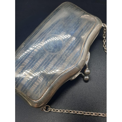 792 - An early white-metal elegant purse. Attached to a white-metal chain with cloth interior. 12 x 8cm. 1... 