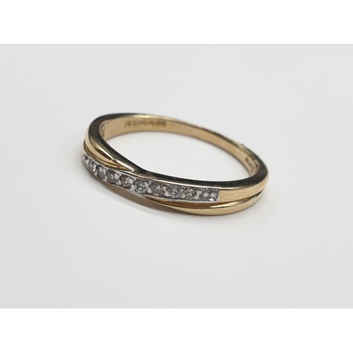 810 - 9ct white gold twist 1/2 eternity diamond ring 0.10ct. Weighs 2g and size O.