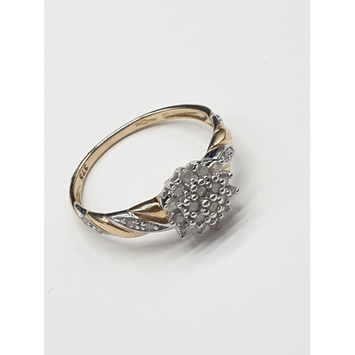 812 - 9ct yellow gold diamond cluster ring. 2.2g and 0.25ct. Size N.