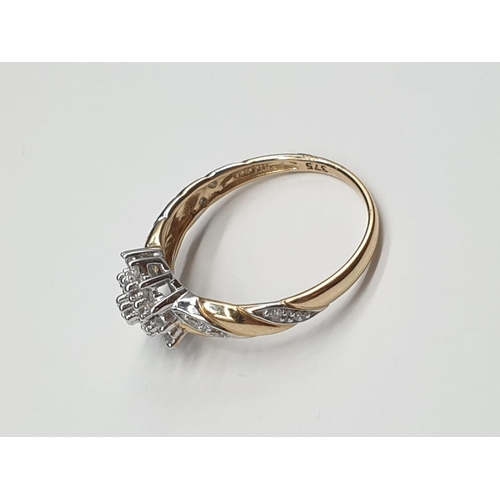 812 - 9ct yellow gold diamond cluster ring. 2.2g and 0.25ct. Size N.