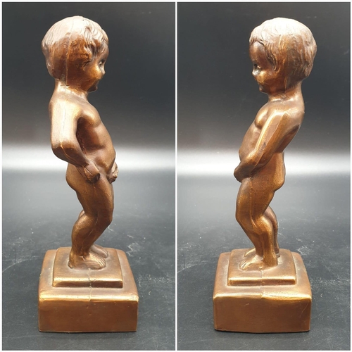 832 - A metal souvenir statue of the famous Peeing Boy of Brussels. 21cm