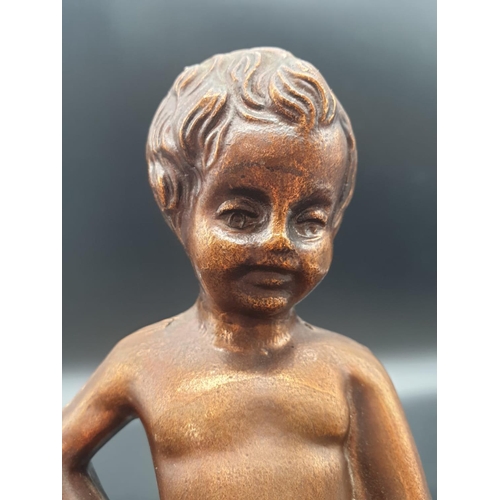 832 - A metal souvenir statue of the famous Peeing Boy of Brussels. 21cm