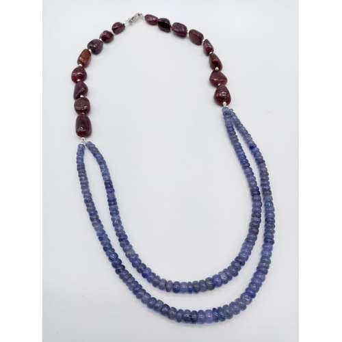 900 - 263cts two row cabochon tanzanite necklace with tumbled ruby beads. 52.8 grams in weight.44cm approx... 